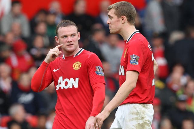 Darren Fletcher (right) and Wayne Rooney are left stunned by the 6-1 defeat to Manchester City