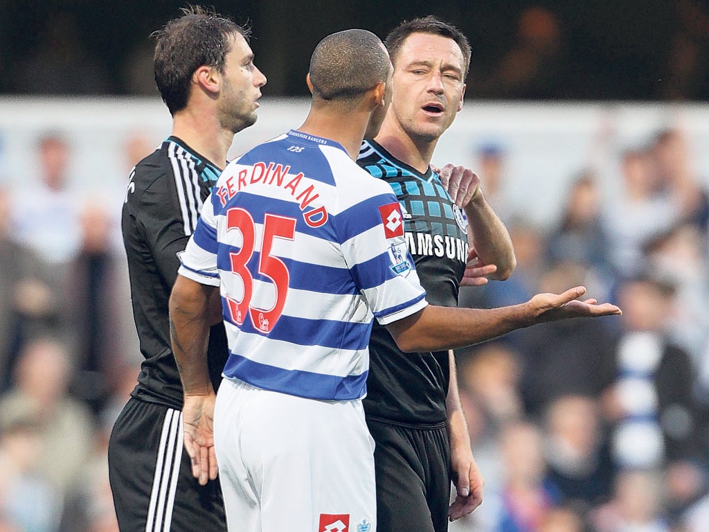 QPR's Anton Ferdinand shares a few words with Terry during Sunday's match at Loftus Road