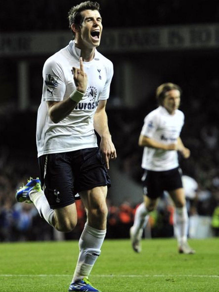 Gareth Bale celebrates scoring his goal against Queen Park Rangers at White Hart Lane