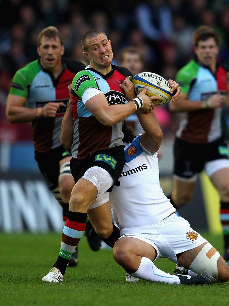 Mike Brown of Harlequins is tackled by Josh Tatupu of Exeter Chiefs on Saturday