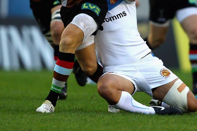 Mike Brown of Harlequins is tackled by Josh Tatupu of Exeter Chiefs on Saturday 