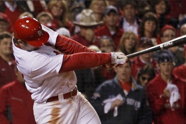 St Louis Cardinals' David Freese hits the winning home run in
the 11th innings of Game Six of the World Series to spark wild celebrations