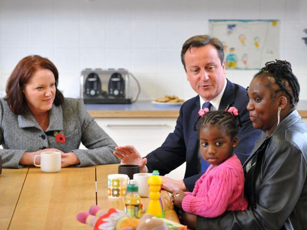 David Cameron speaks with adoptive mothers Tracy McLauchlan (left) and Karen McKellar and her adoptive daughter Angel