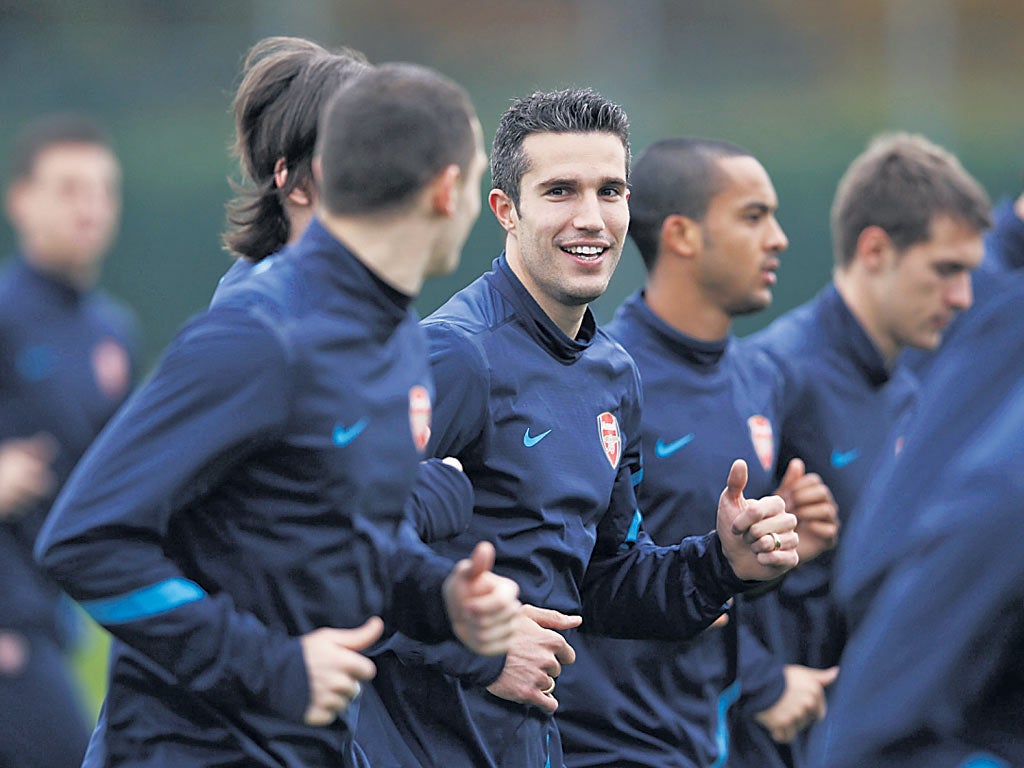 Robin van Persie is all smiles during Arsenal training yesterday