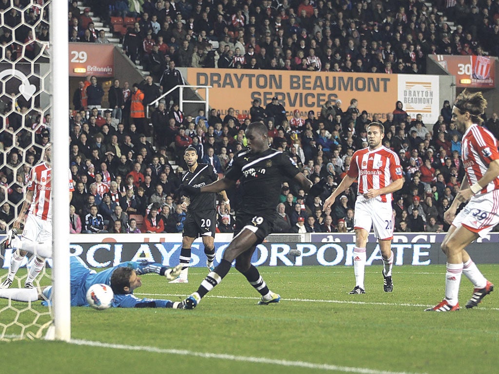 Newcastle’s Demba Ba scores the second of his three goals last night