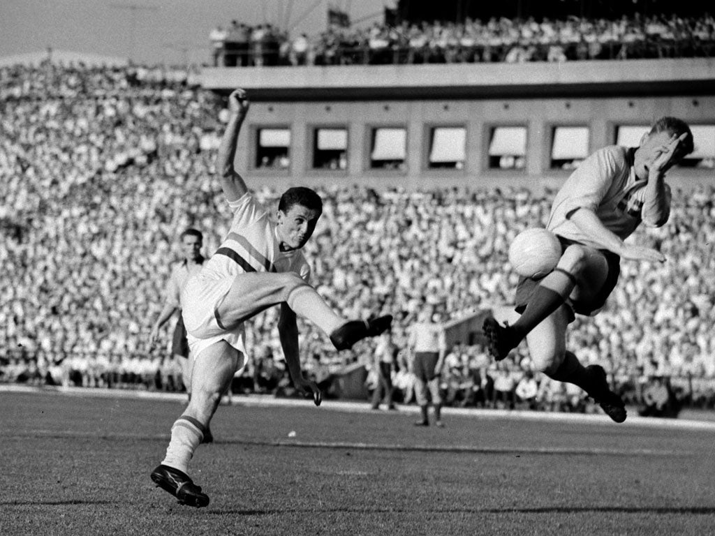 Albert, left, goes for goal in Hungary's 3-2 win against Sweden at the Nepstadion, Budapest in 1959