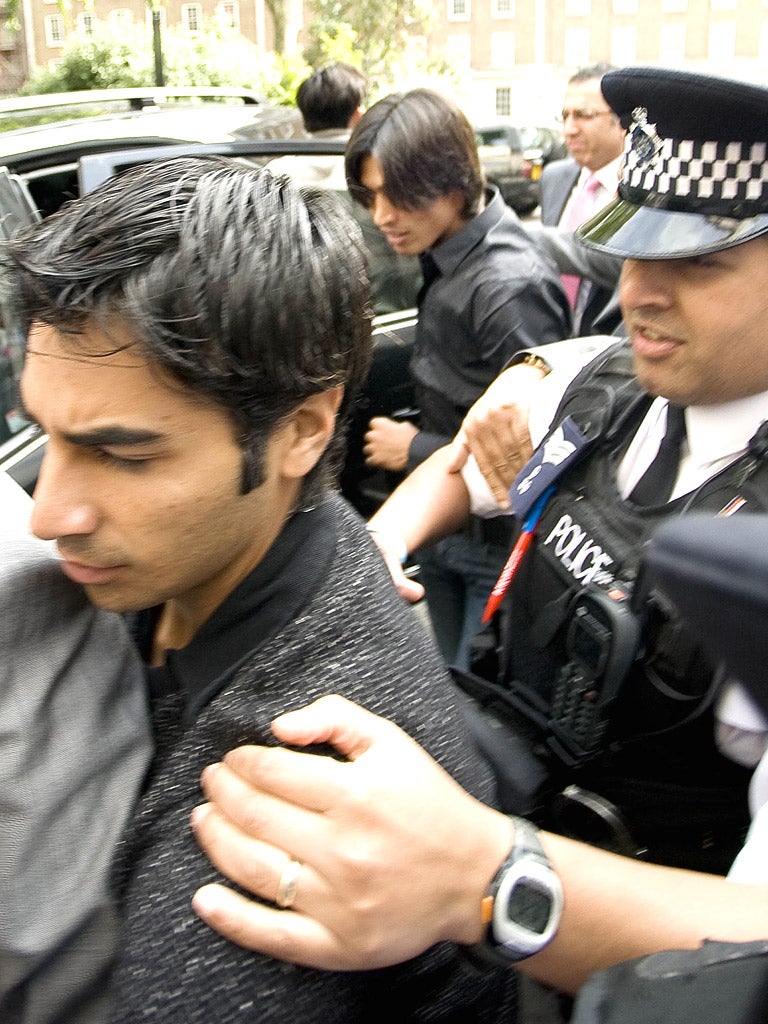 Salman Butt, left, arrives at court yesterday with Mohammad Amir