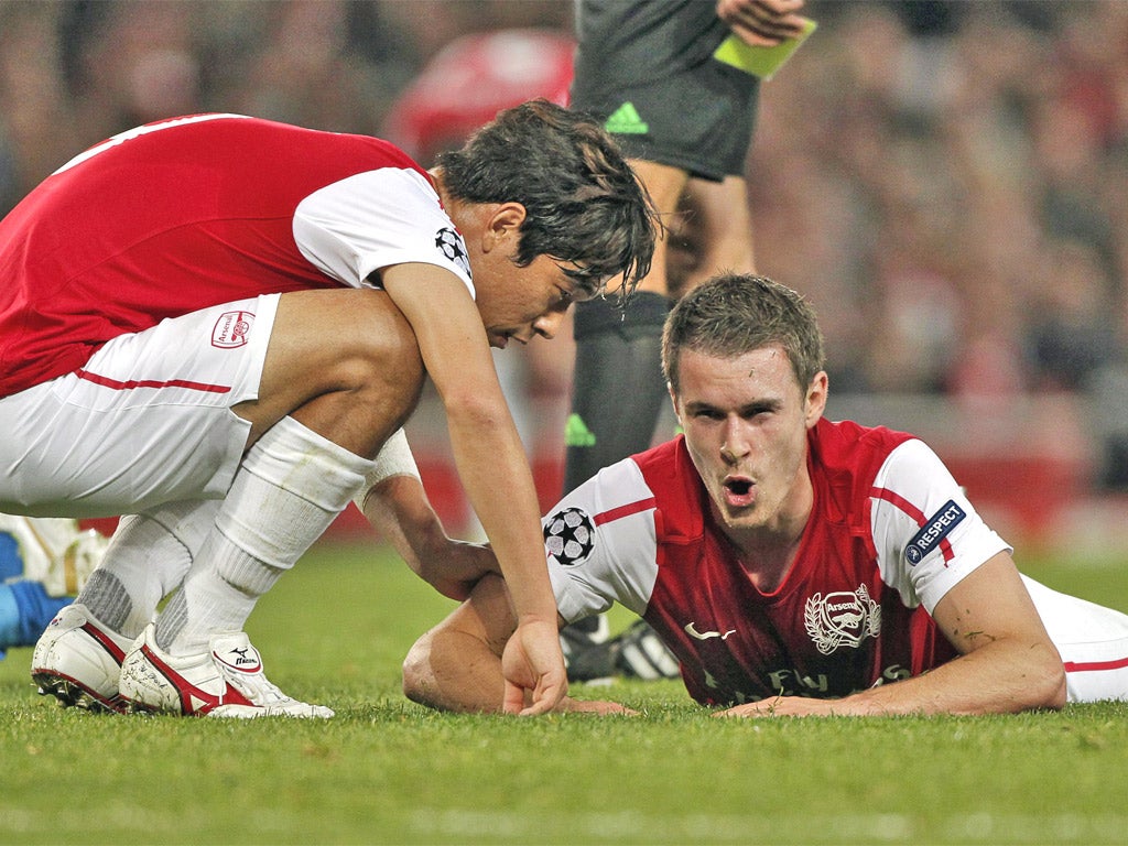 Arsenal’s Aaron Ramsey and Park Ju-young react as a chance goes begging last night