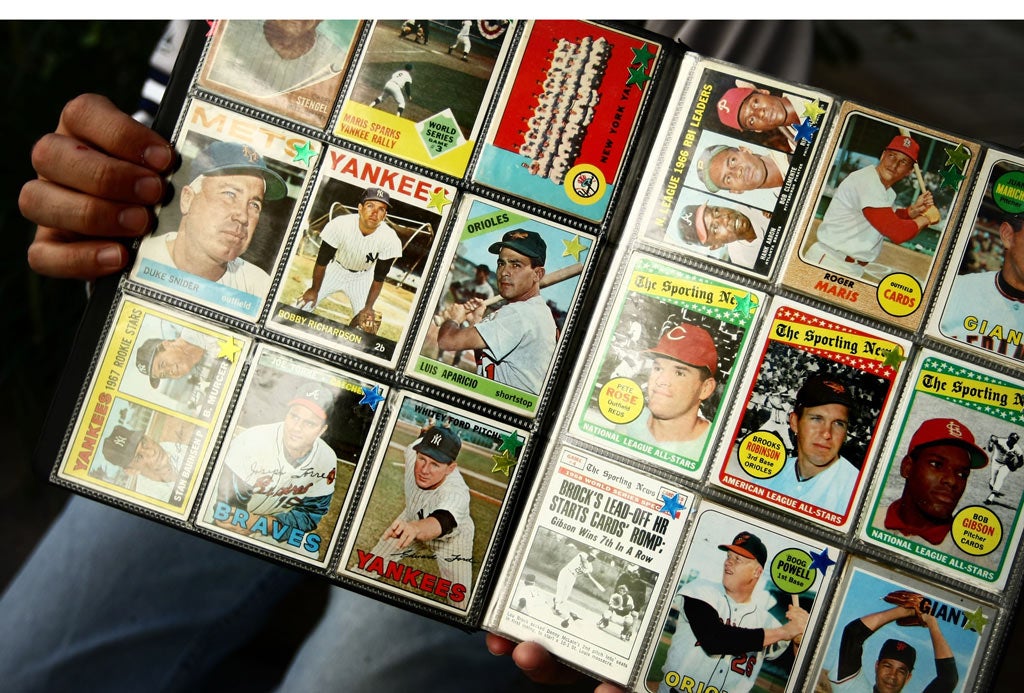 A man sells vintage baseball cards at Yankee Stadium September 2008