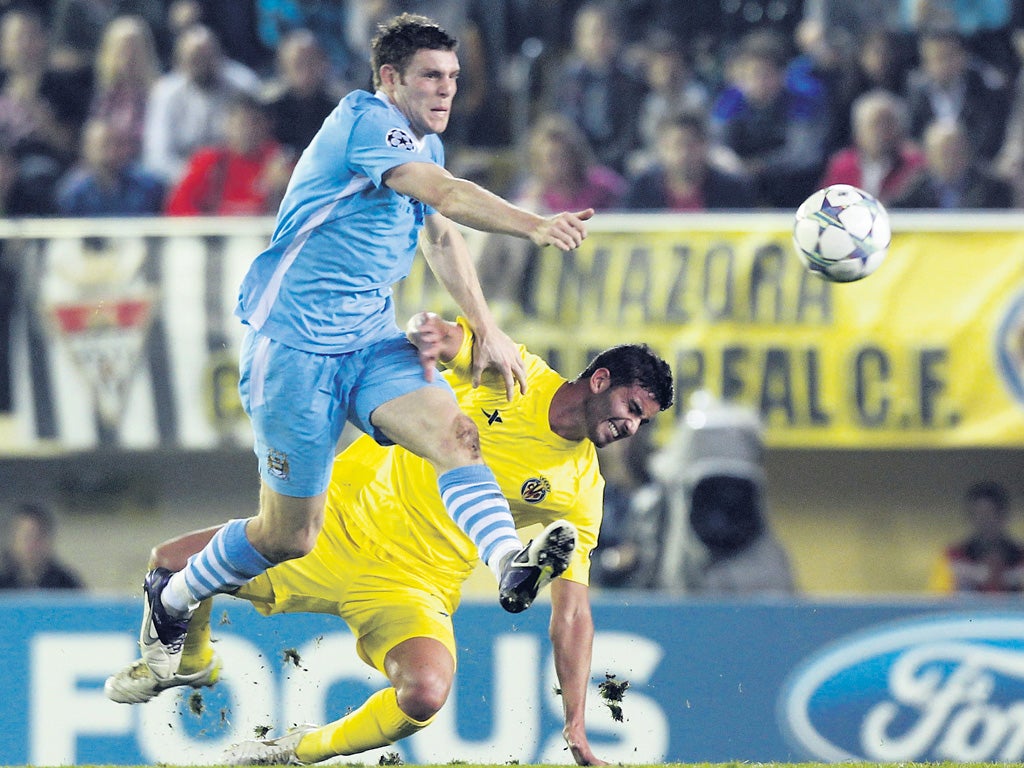 Manchester City midfielder James Milner tangles with Villarreal's Mateo Mussachio during an excellent away win for City last night