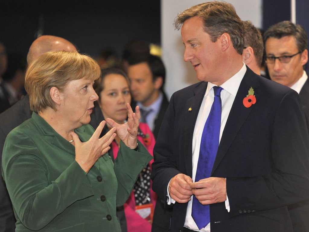 Germany's chancellor Angela Merkel speaks to Prime Minister David Cameron at the G20 summit