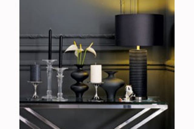 By varying the heights of these black candles, the look is informal yet sleek. All available at the new John Lewis candle shop. 