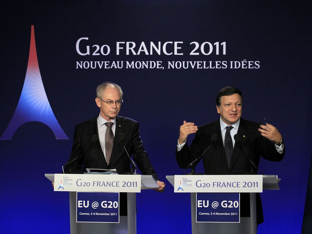 European Commission President Jose Manuel Barroso (right) address a news conference today
