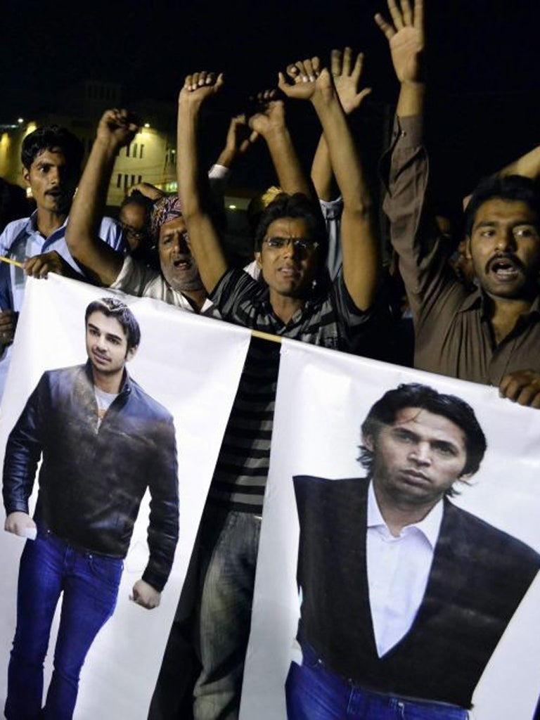 Furious Pakistan fans vent their anger by burning effigies of the cricketers who were convicted in London for their part in the
spot-fixing trial