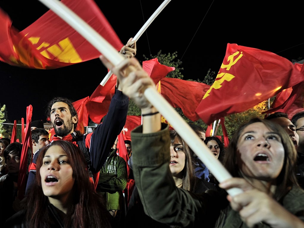 Greek Communists rally outside the parliament in Athens yesterday