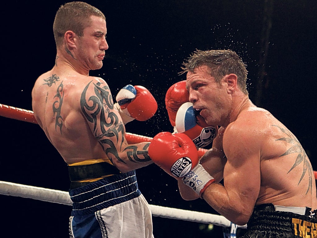 Too hot to handle: Ricky Burns unleashes a right hand on Michael Katsidis of Australia during the Scot’s victory at Wembley