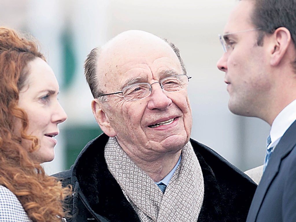 Paymasters Rebekah Brooks, Rupert Murdoch and his son James last year