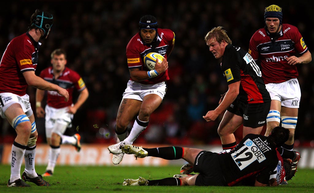Sale's captain, Sam Tuitupou, attempts to break through the Saracens line at Vicarage Road yesterday
