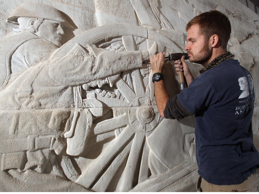Rory Smith, a stonemason, puts the finishing touches to the
refurbishment of the Royal Artillery Memorial at Hyde Park Corner