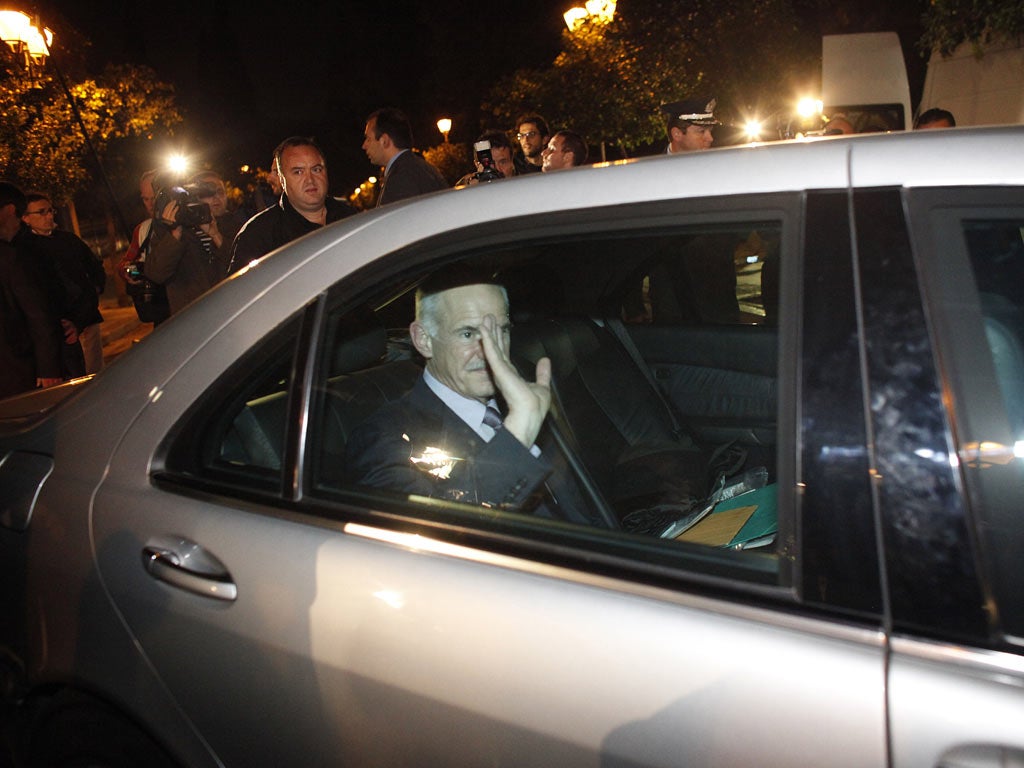 PrimeMinister George Papandreou leaves his meeting with President Karolos Papoulias