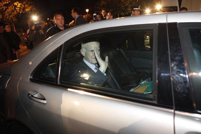 PrimeMinister George Papandreou leaves his meeting with President Karolos Papoulias