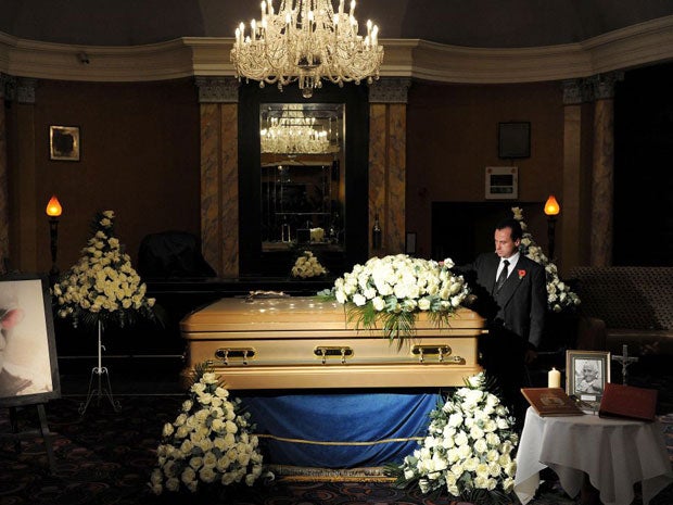 The golden coffin of Sir Jimmy Savile inside the Queens Hotel in Leeds where the public can pay their respects