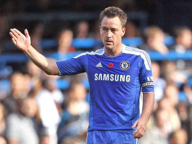 The England captain John Terry proudly wears a poppy on his
Chelsea shirt