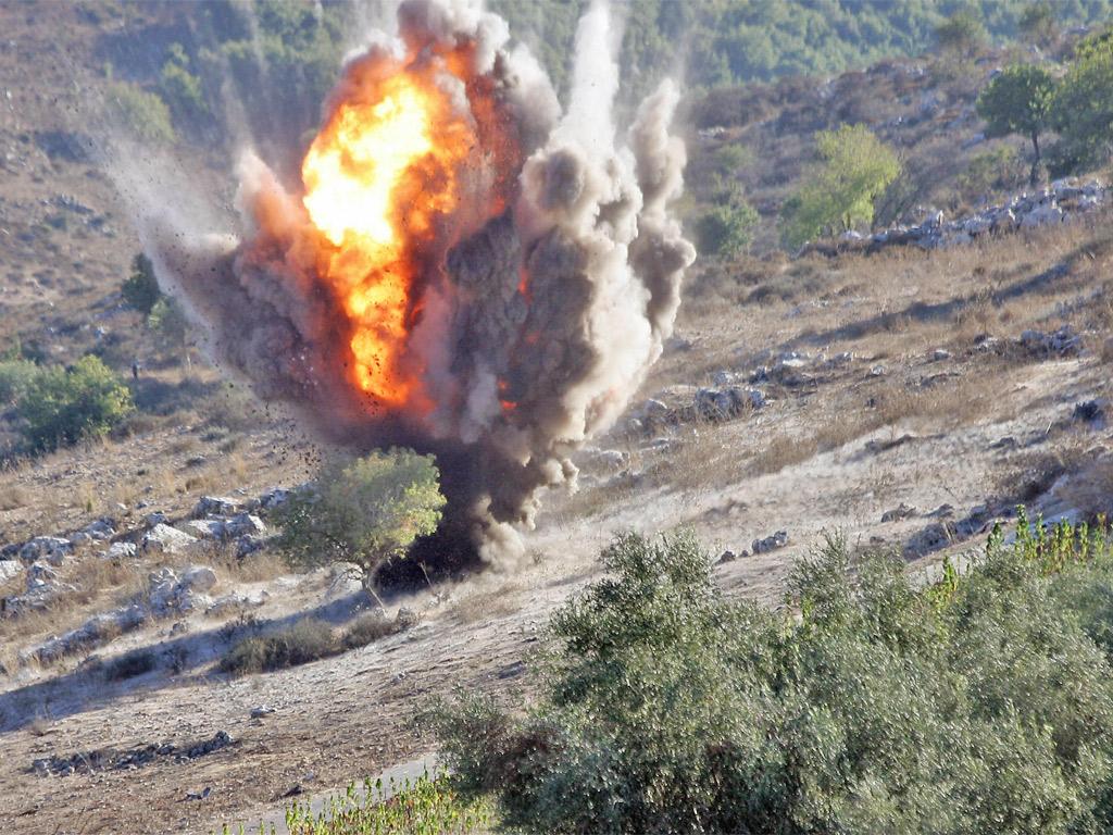 An unexploded cluster bomb is detonated in southern Lebanon
