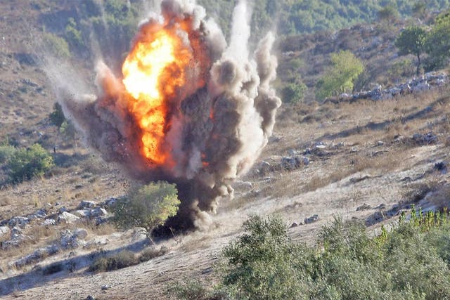An unexploded cluster bomb is detonated in southern Lebanon
