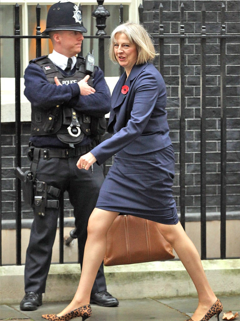 Theresa May arrives for the weekly Cabinet meeting at 10 Downing Street yesterday