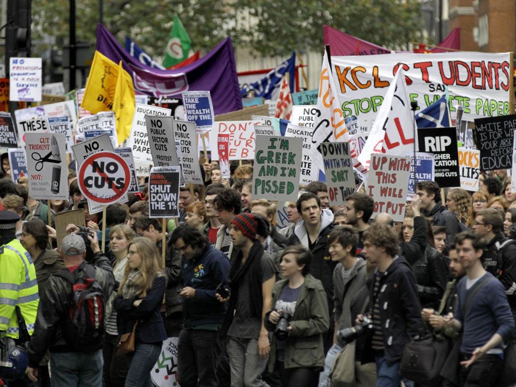 Students and campaigners march through the streets of London to protest against higher tuition fees in 2011