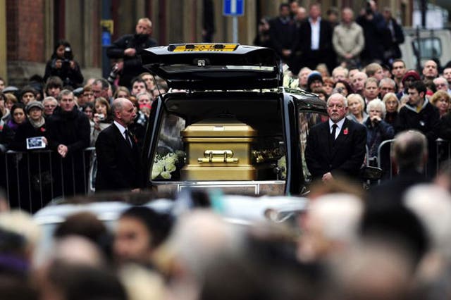 The coffin of Sir Jimmy Savile arrives outside St Anne's Cathedral in Leeds, where his funeral took place