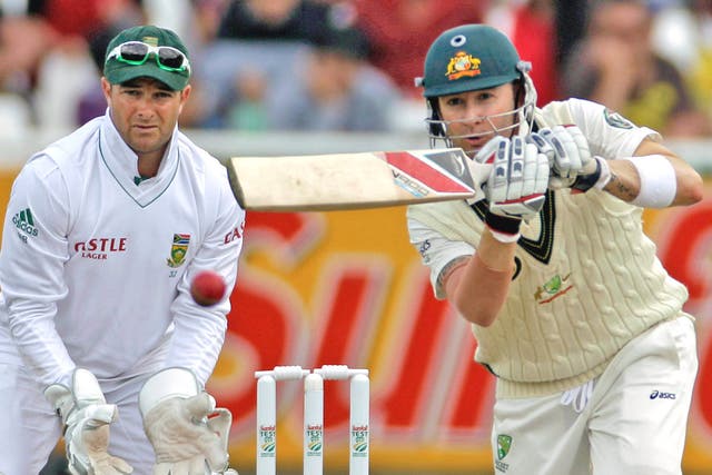 South Africa keeper Mark Boucher watches Australia captain Michael Clarke smash his way to 107 in Cape Town