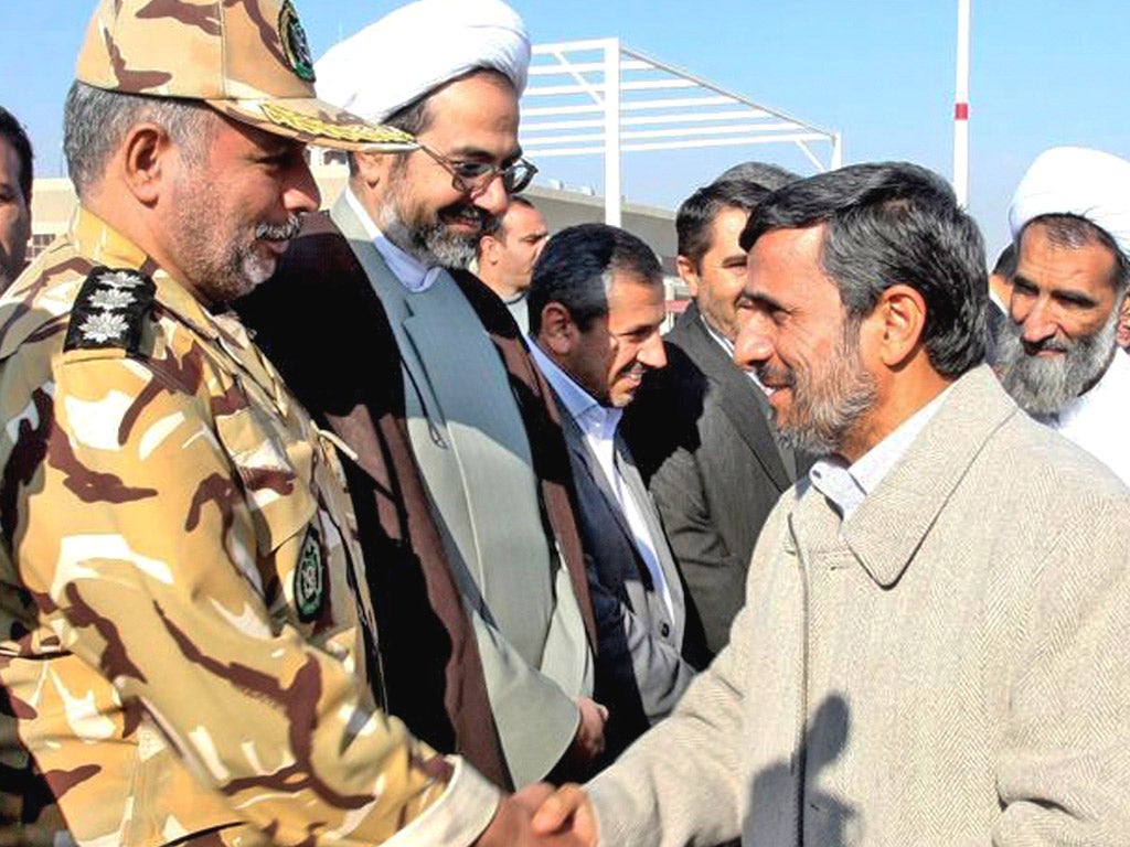 Iranian president Mahmoud Ahmadinejad, right, has vowed
Iran will not retreat 'one iota' from its nuclear programme