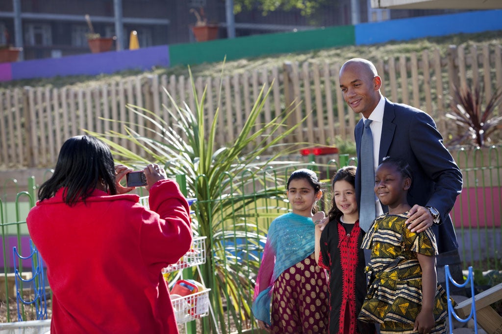 Chuka Umunna poses with children from his local Streatham primary school, Jubilee, on 'Traditional Clothes Day'