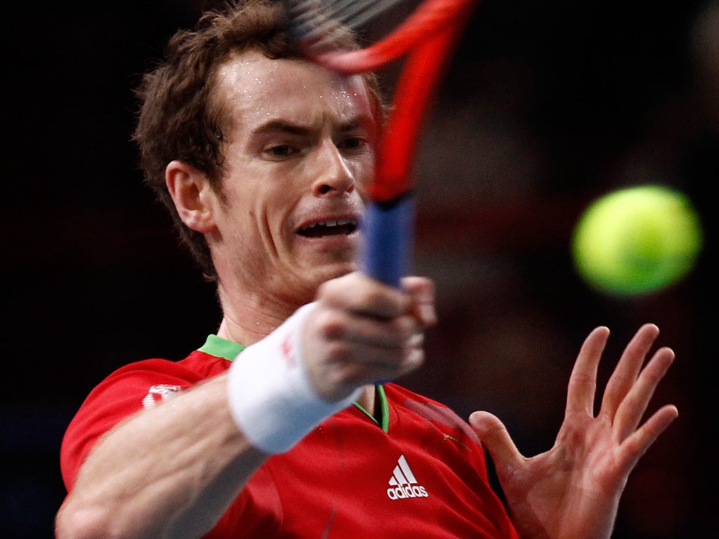 Andy Murray returns the ball to Andy Roddick during his victory over the American in Paris yesterday