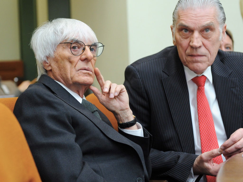 Bernie Ecclestone with his lawyer, Sven Thomas, in court yesterday