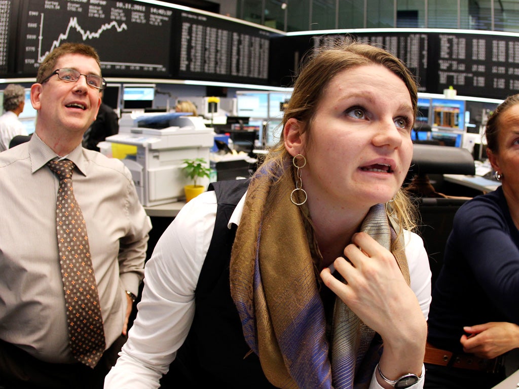 Traders in Frankfurt yesterday