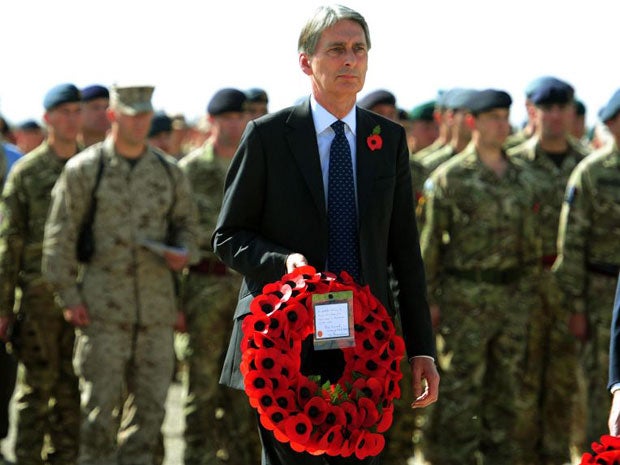 Philip Hammond marked Armistice Day alongside troops in Afghanistan at a special parade in Camp Bastion today