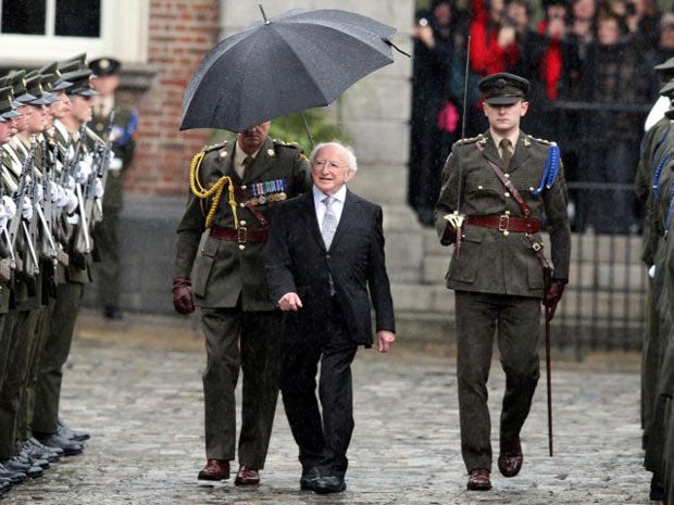 President Michael D Higgins inspects the guard of honour after his inauguration ceremony