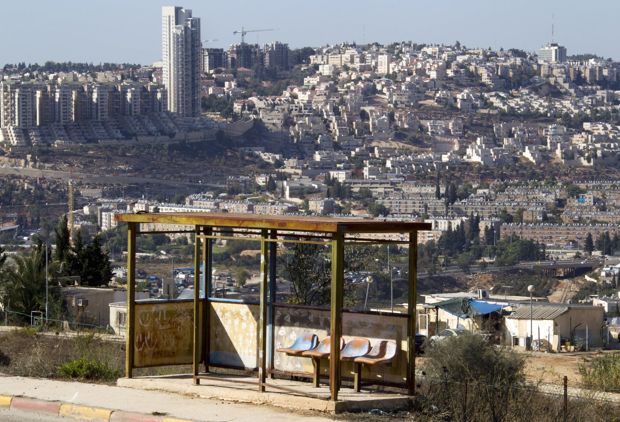 An abandoned bus stop rusts by the roadside in the Givat Hamatos area of southern Jerusalem