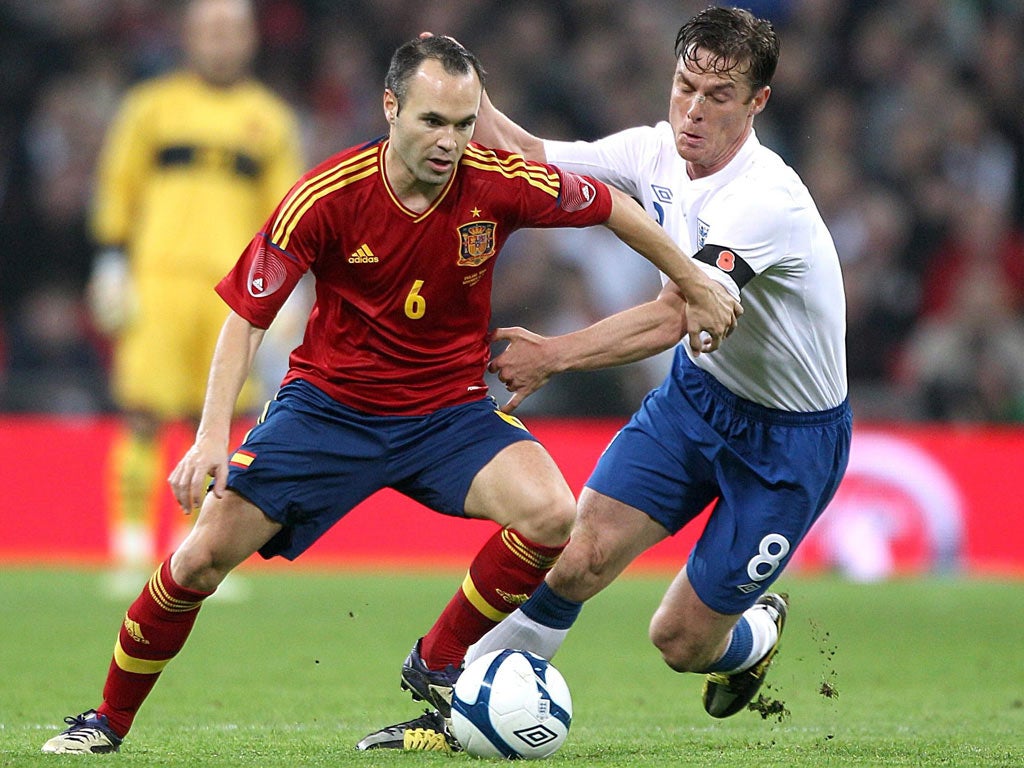 England's Scott Parker spent the evening stopping Andres Iniesta pick out passes to his Spain team-mate David Silva at Wembley on Saturday