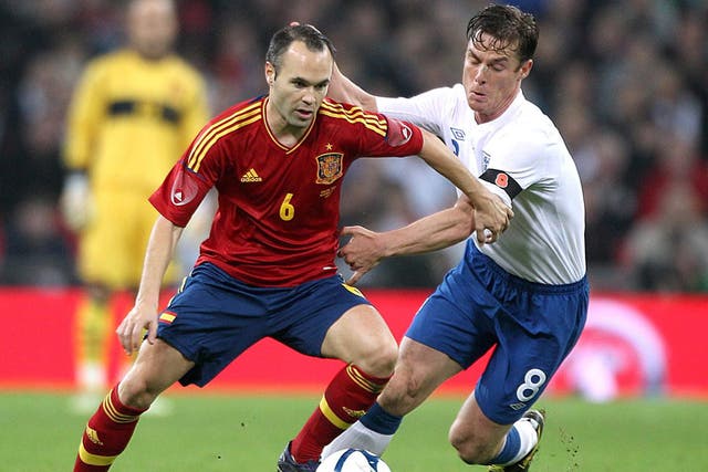 England's Scott Parker spent the evening stopping Andres Iniesta pick out passes to his Spain team-mate David Silva at Wembley on Saturday