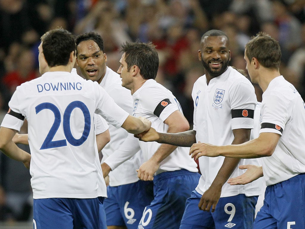 Team-mates congratulate Frank Lampard for heading England's goal but the win throws up questions for the manager