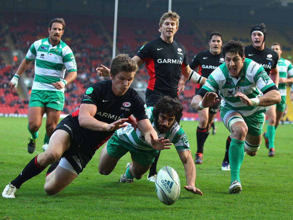 Owen Farrell wins a race for the loose ball to score Saracens' opening try yesterday