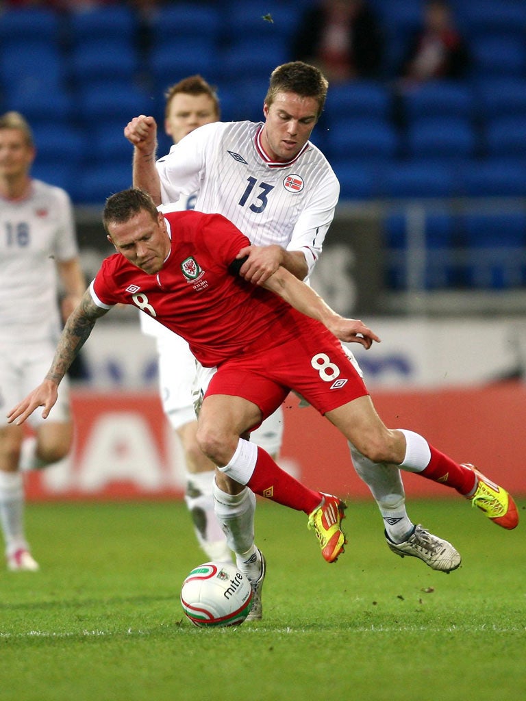 Craig Bellamy is fouled by Norway's Espen Ruud during Wales' thumping friendly win in Cardiff on Saturday