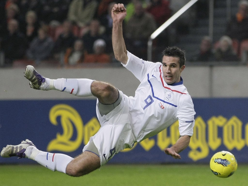 Robin van Persie shoots for the Netherlands against Switzerland