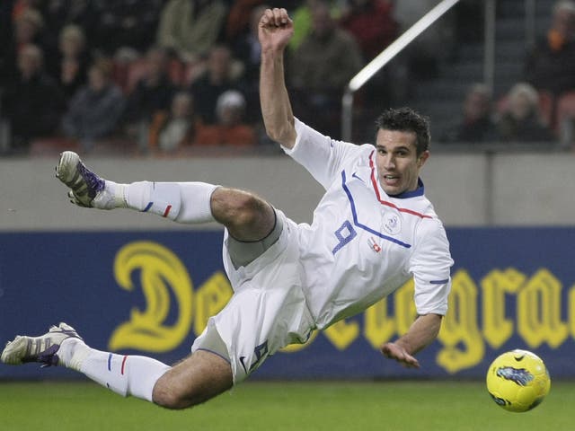 Robin van Persie shoots for the Netherlands against Switzerland