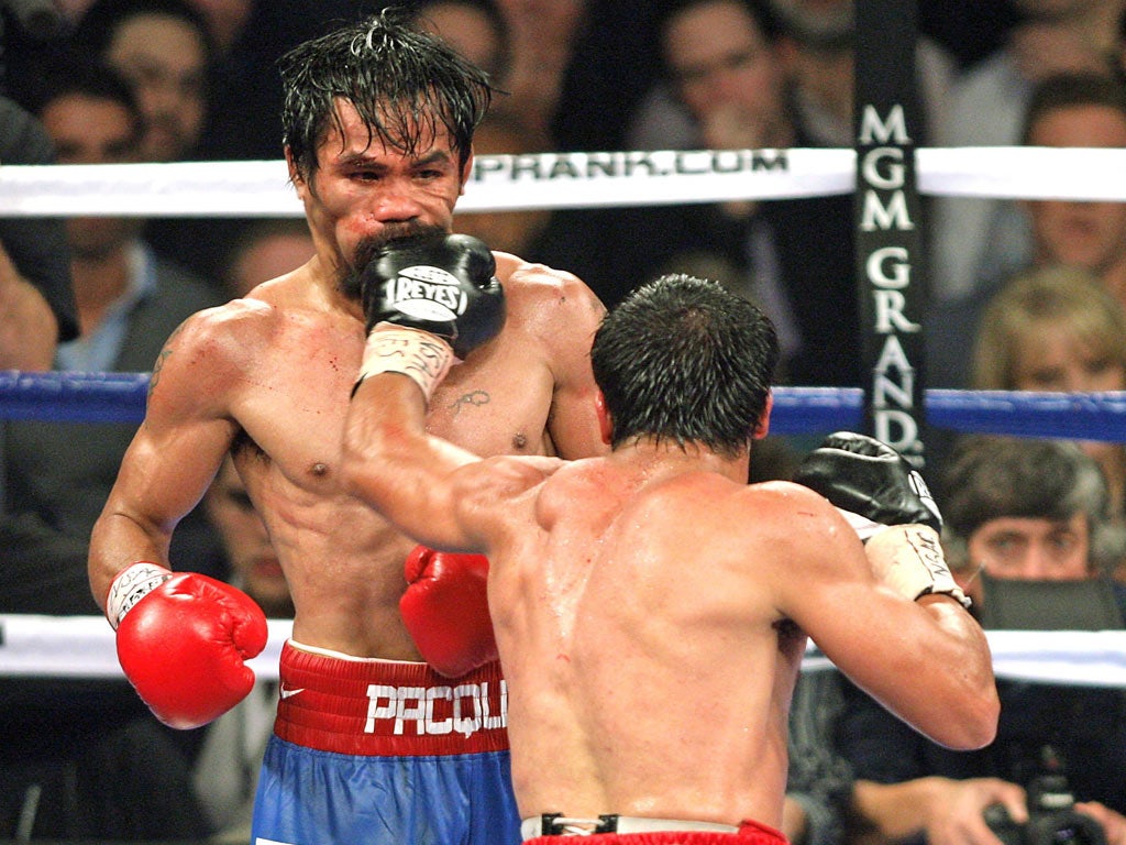 Juan Manuel Marquez connects with Manny Pacquiao's chin