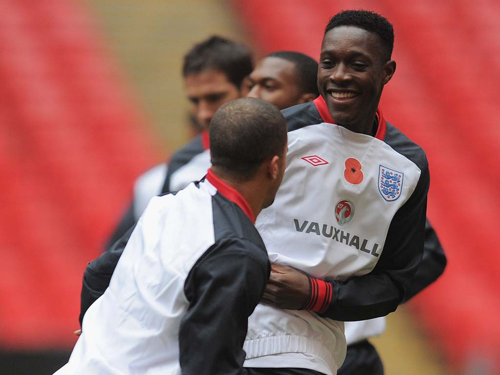 Welbeck and Walker pictured training. Both are expected to start tonight